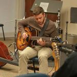 Guitar student playing guitar